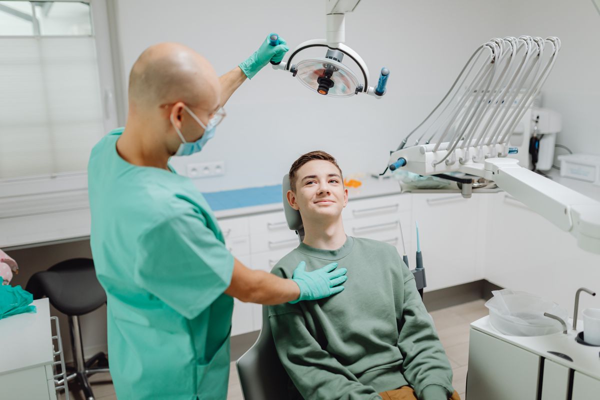 Dentist reassuring a patient